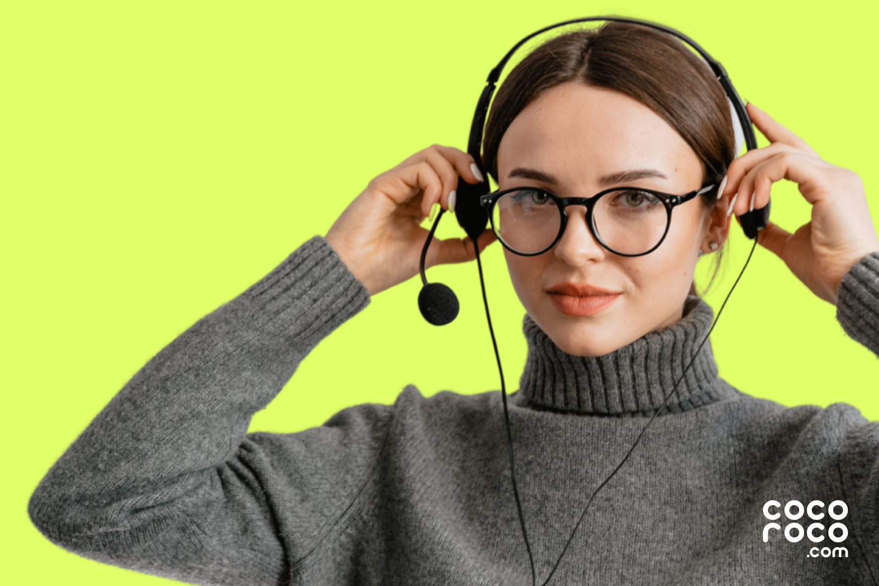 Woman in glasses and a turtleneck putting on a headset